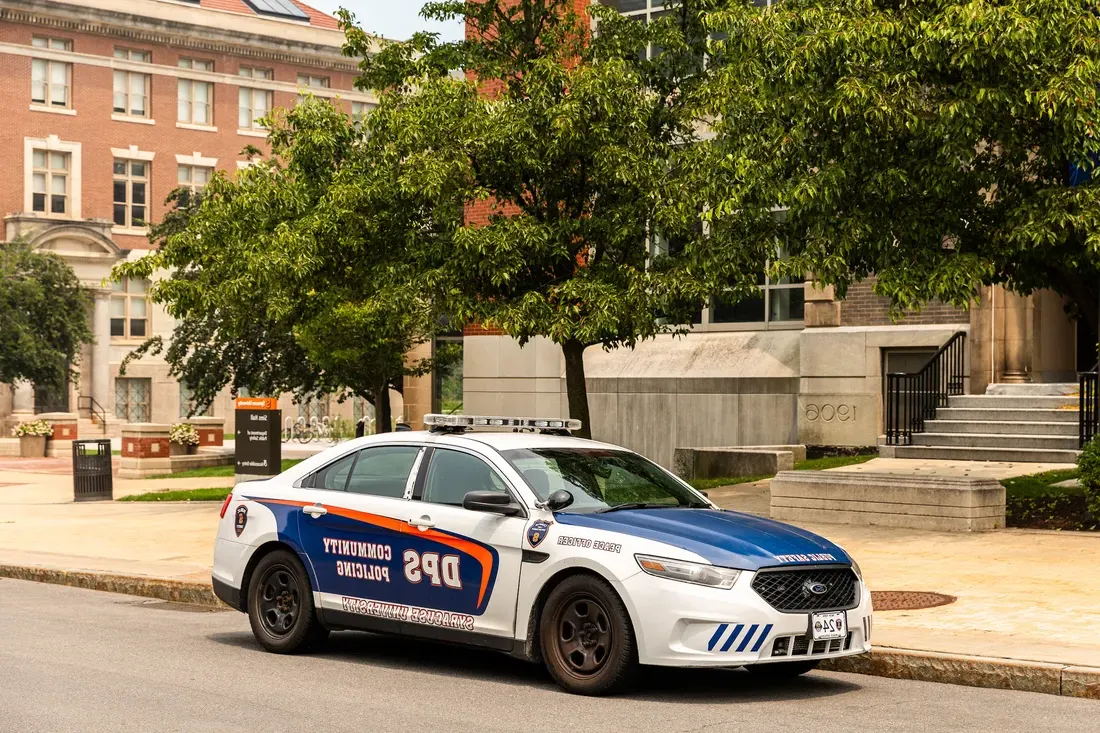 A public safety car parked outside of a building.