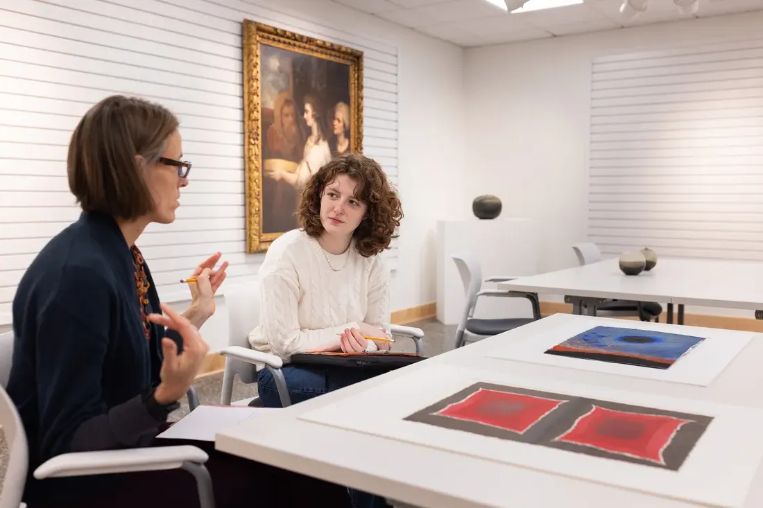 Sascha Scott reviews artwork for an upcoming show with her museum curation students at the SU Art Museum, fall 2023.