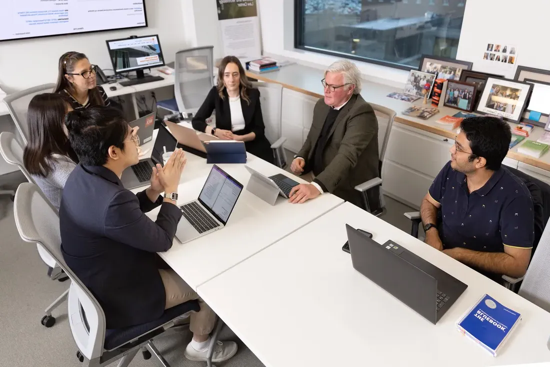 A group of students and Professor Brian Gerling meet in the Innovation Law Center.